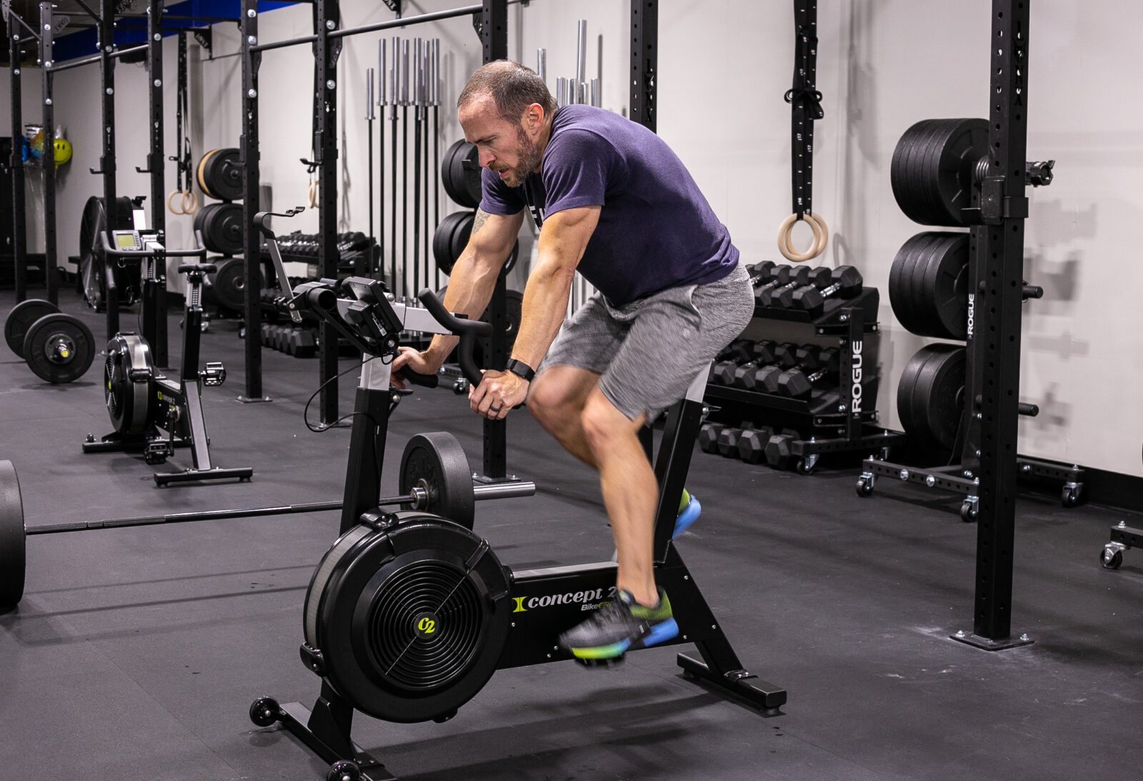 Trainer riding an exercise bike.